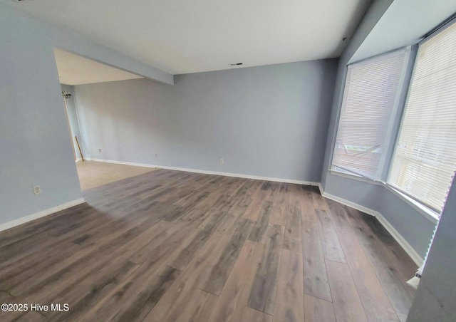 spare room featuring hardwood / wood-style floors