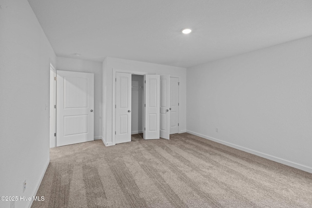 unfurnished bedroom with light carpet