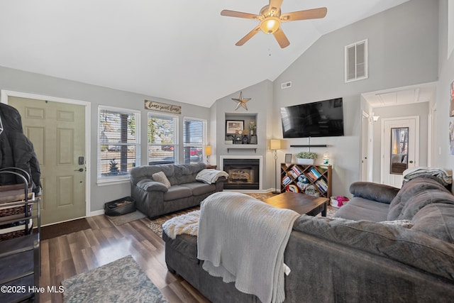 living room featuring high vaulted ceiling, dark hardwood / wood-style floors, and ceiling fan