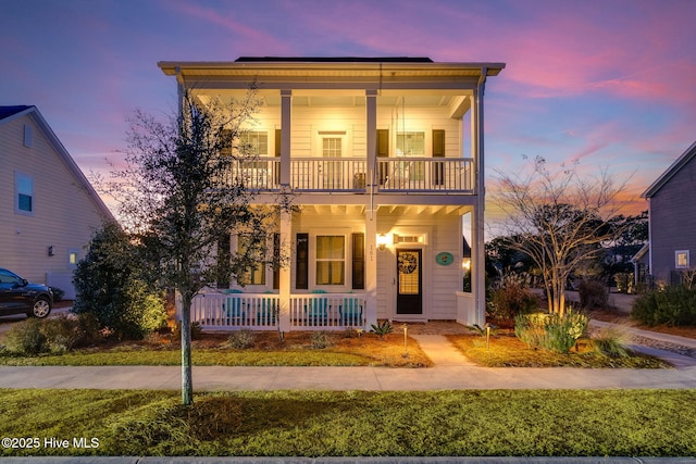 italianate house with covered porch and a balcony