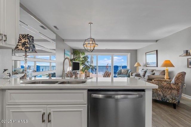 kitchen featuring white cabinetry, dishwasher, light hardwood / wood-style flooring, and sink