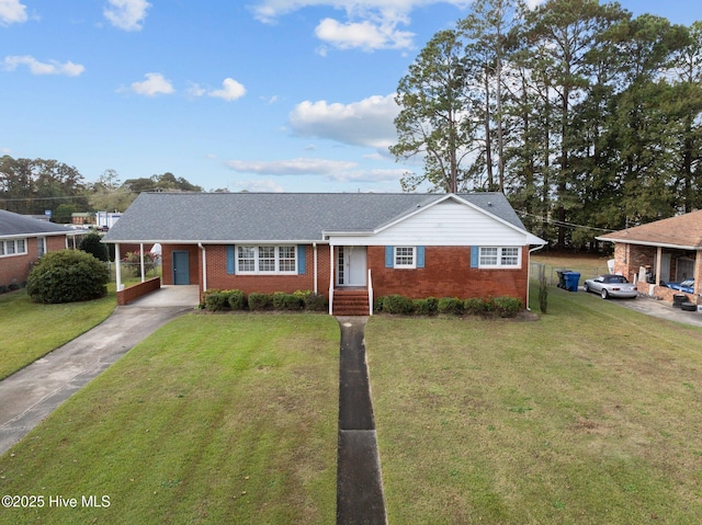 ranch-style house with a carport and a front lawn