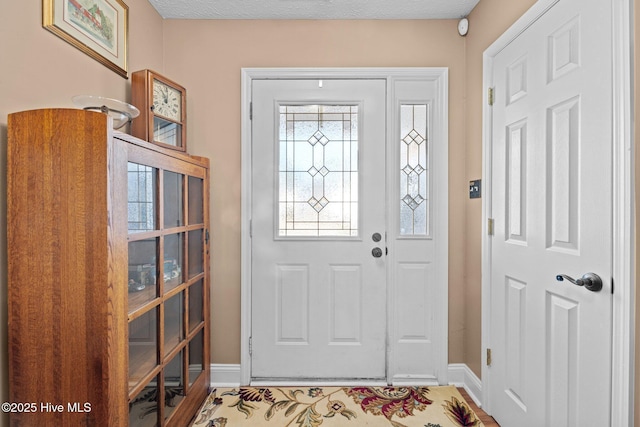 entryway featuring a textured ceiling