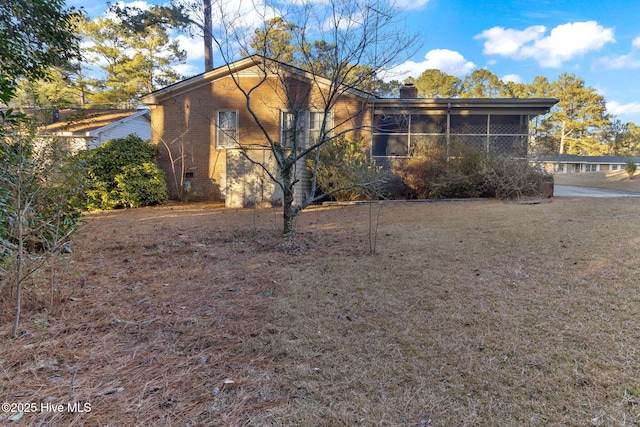 exterior space featuring a sunroom