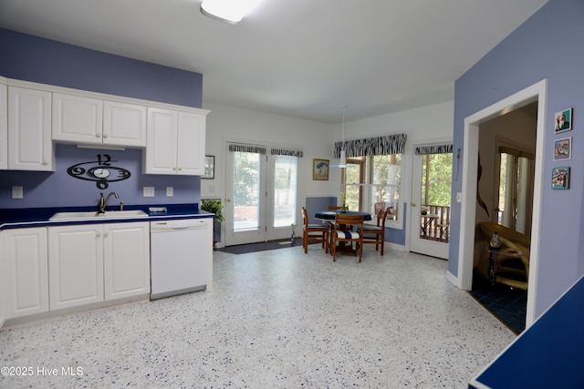 kitchen featuring sink, dishwasher, french doors, and white cabinets