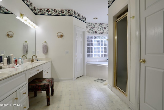 bathroom featuring vanity and shower with separate bathtub