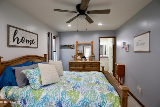 carpeted bedroom with connected bathroom and ceiling fan