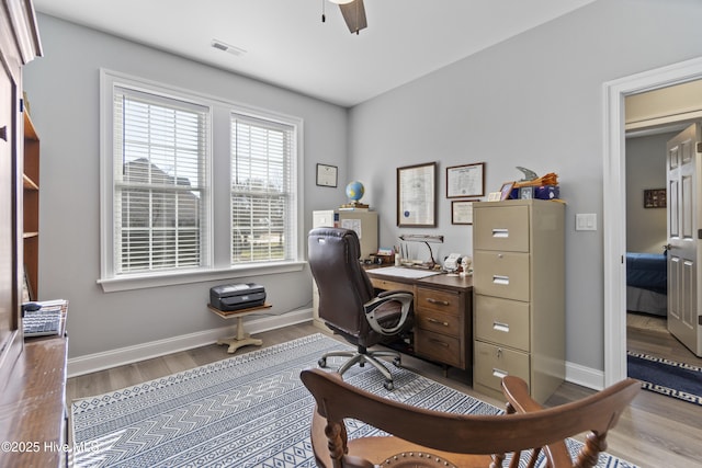 office area with hardwood / wood-style flooring and ceiling fan