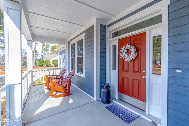 property entrance with covered porch