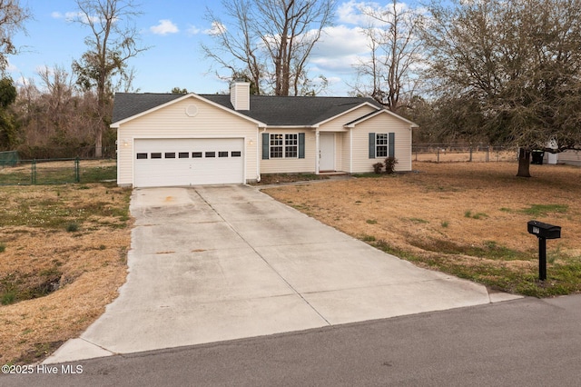 single story home with a garage, driveway, a chimney, and fence