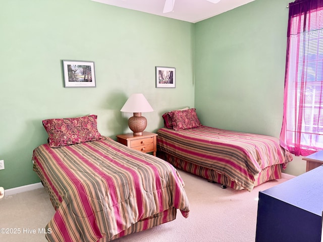 bedroom featuring ceiling fan and carpet floors