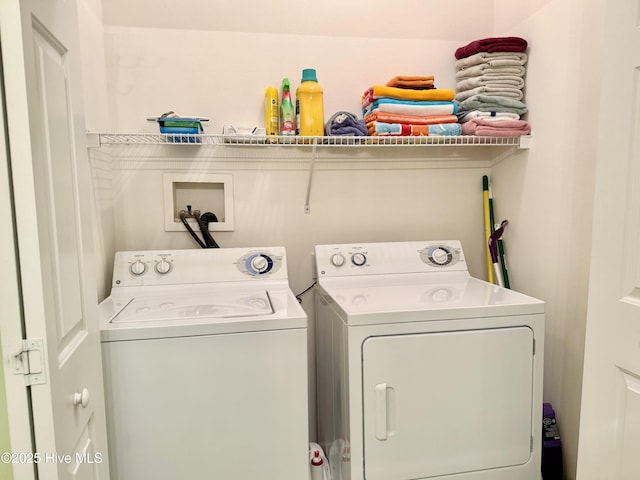 washroom with independent washer and dryer