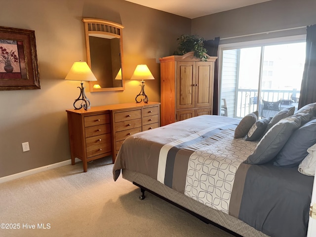 bedroom featuring access to exterior, baseboards, and light carpet