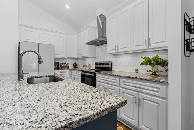 kitchen featuring decorative backsplash, light stone countertops, stainless steel electric stove, wall chimney range hood, and white cabinetry