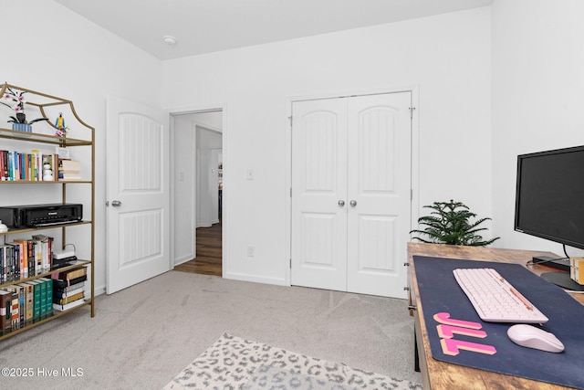 home office with carpet floors and baseboards