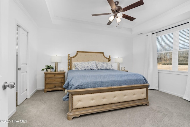 bedroom featuring ornamental molding, carpet flooring, and a raised ceiling