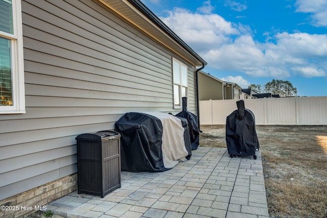 view of patio with fence and area for grilling