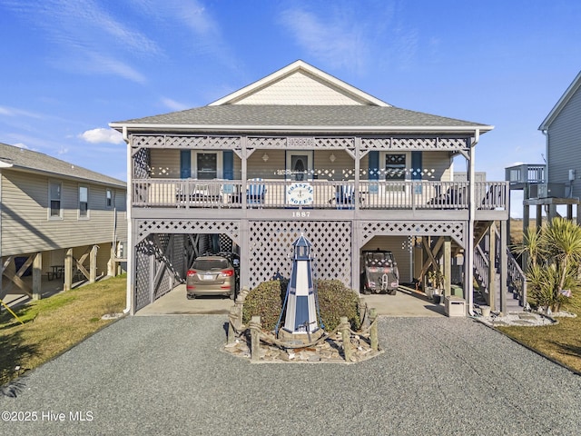 view of front of house with a carport and covered porch