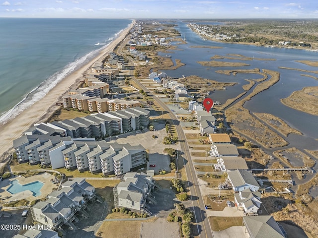 drone / aerial view with a view of the beach and a water view