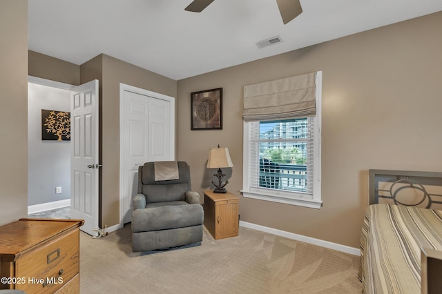 sitting room with light carpet and ceiling fan