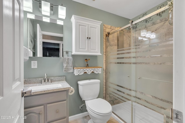 bathroom with tile patterned flooring, toilet, a shower with door, and vanity