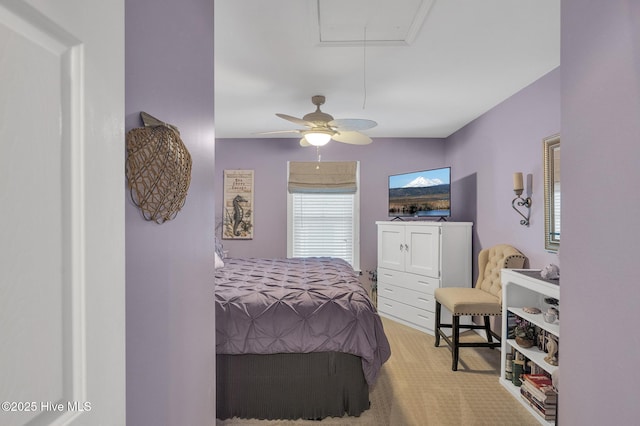 bedroom with ceiling fan and light carpet