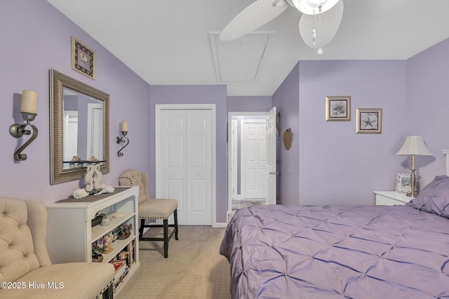 bedroom with ceiling fan, a closet, and light carpet