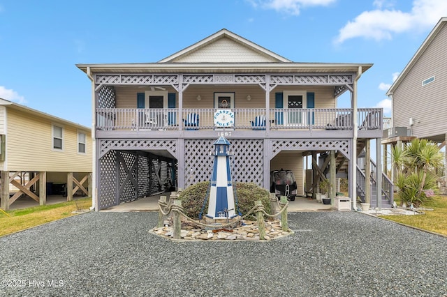 view of front of house with covered porch and a carport