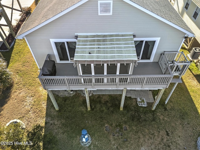 rear view of house featuring a deck and central AC