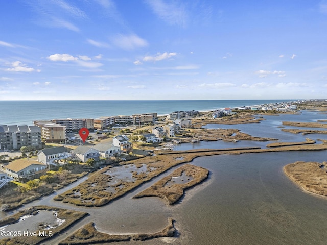 bird's eye view with a water view