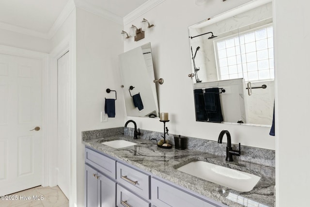 bathroom featuring ornamental molding and vanity