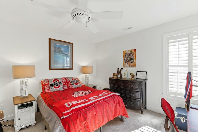 bedroom featuring light carpet and ceiling fan