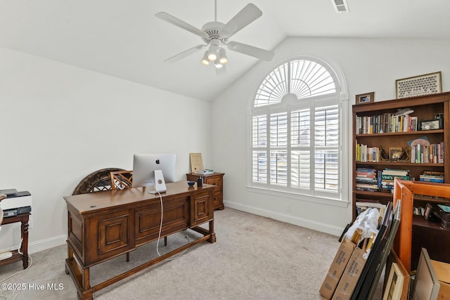 office featuring lofted ceiling, a healthy amount of sunlight, light carpet, and ceiling fan