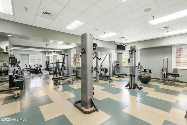 workout area featuring a drop ceiling