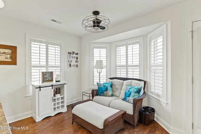 sitting room featuring dark hardwood / wood-style flooring