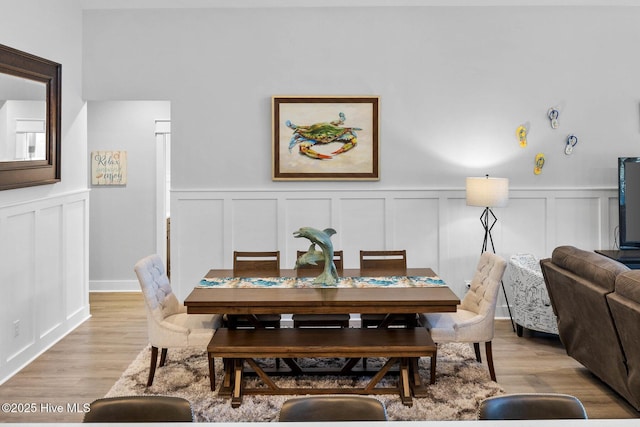 dining area with light hardwood / wood-style floors