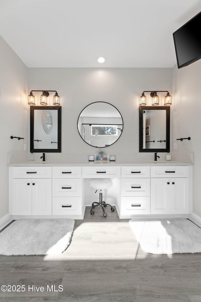 bathroom featuring vanity and hardwood / wood-style flooring