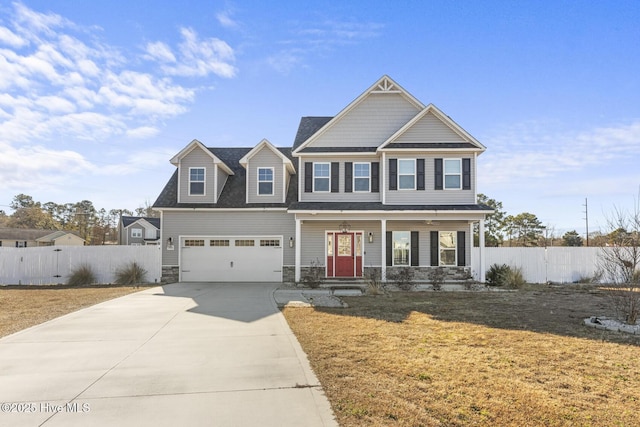 view of front facade with a front yard and a garage