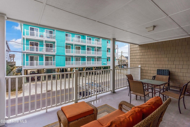 1503 Carolina Beach Ave N Unit 1D, Carolina Beach, NC 28428 - balcony featuring outdoor lounge area