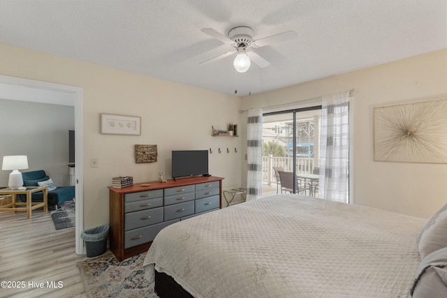 1503 Carolina Beach Ave N Unit 1D, Carolina Beach, NC 28428 - bedroom with access to exterior, light wood-style flooring, and ceiling fan