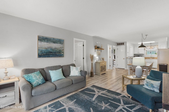1503 Carolina Beach Ave N Unit 1D, Carolina Beach, NC 28428 - living area with light wood-type flooring