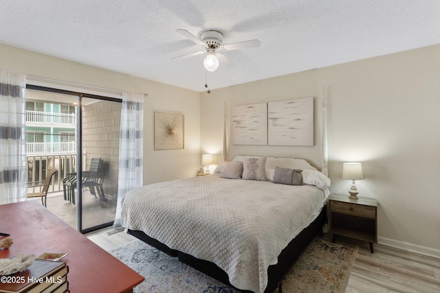 1503 Carolina Beach Ave N Unit 1D, Carolina Beach, NC 28428 - bedroom featuring access to outside, light wood-style floors, baseboards, a ceiling fan, and a textured ceiling