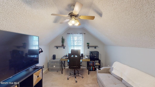 carpeted office space with ceiling fan, vaulted ceiling, and a textured ceiling