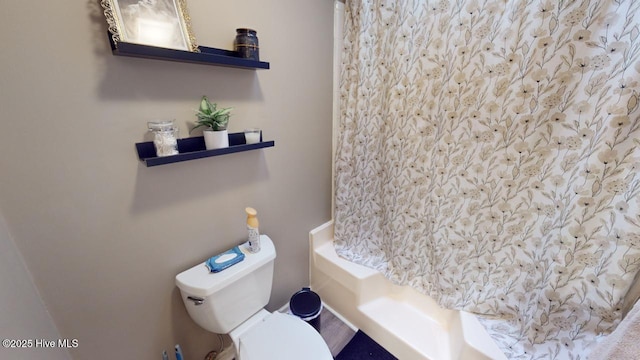 bathroom with walk in shower and toilet