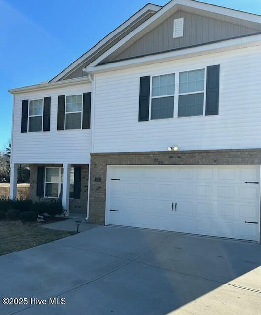 view of front of property featuring a garage