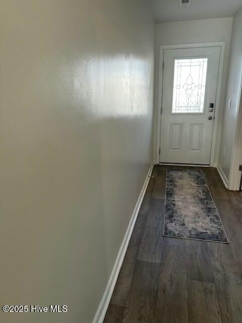 doorway to outside with dark hardwood / wood-style floors