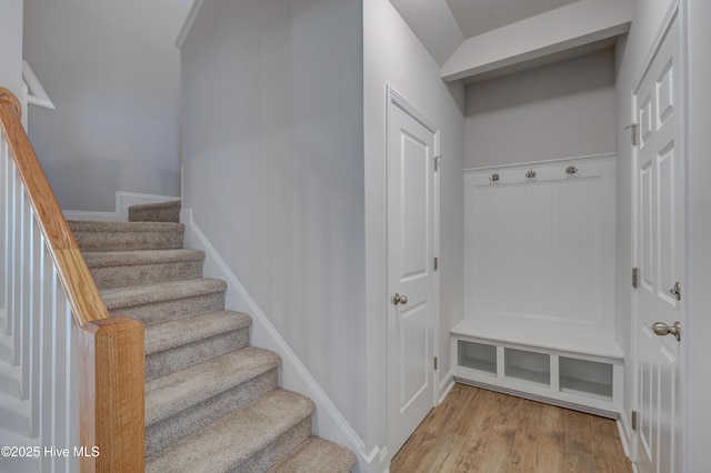 mudroom featuring wood finished floors and baseboards