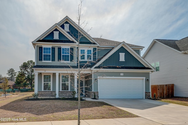 craftsman-style home with driveway, an attached garage, fence, board and batten siding, and brick siding