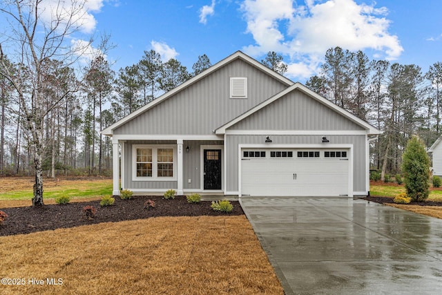 modern farmhouse with a garage, driveway, and board and batten siding