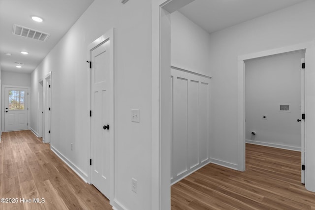 bedroom featuring ceiling fan, wood finished floors, visible vents, and baseboards